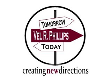 Maroon and white logo with a signpost with three arrows on it. The one on top says "Tomorrow," the one in the middle says "Vel R. Phillips," and the one on the bottom says "Today." The signpost is surrounded by a black circle outline, underneath which are the words "creating new directions."